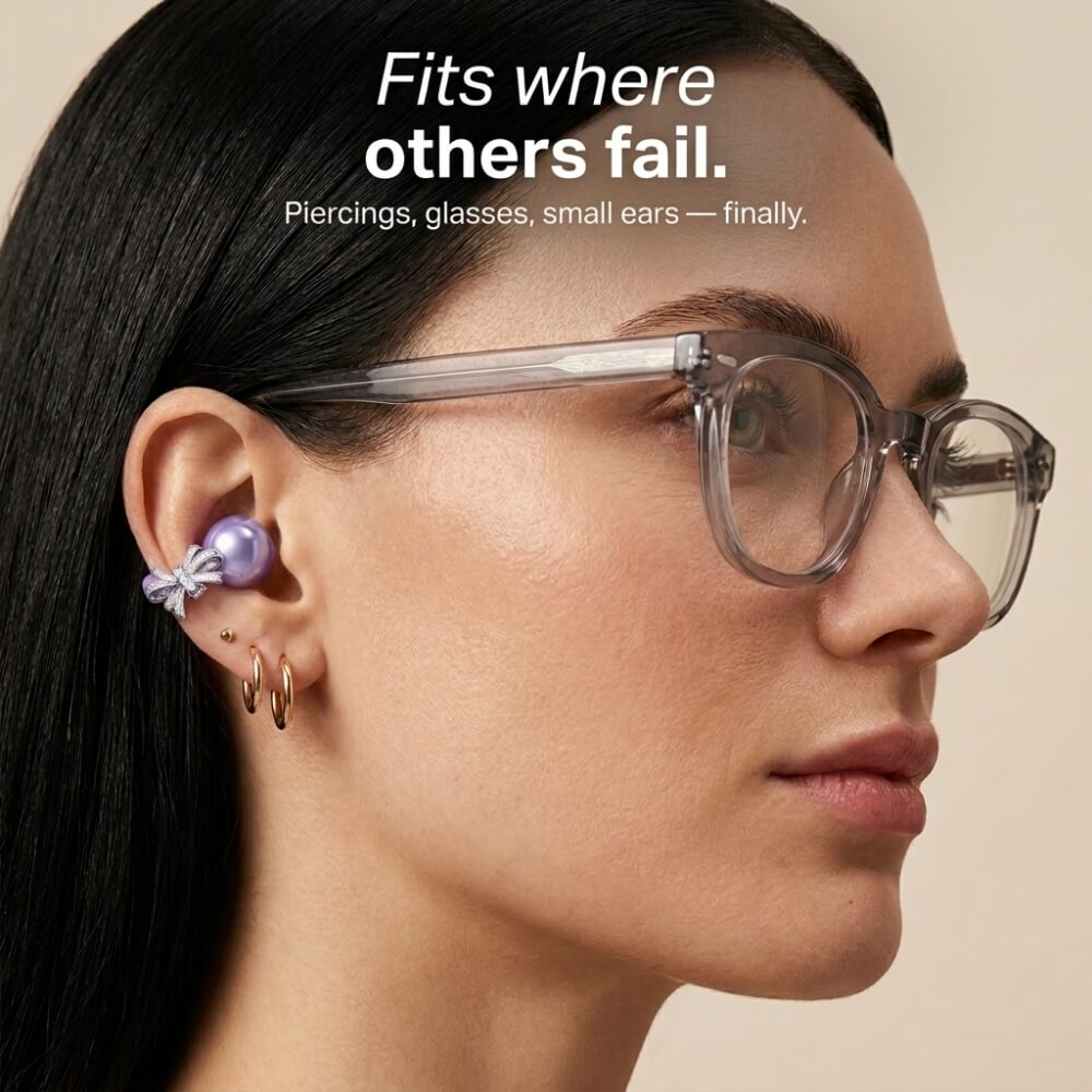Woman wearing clip-on earbuds with glasses and earrings